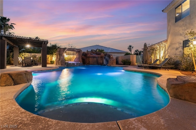 352 Angels Trace Ct, Las Vegas, NV 89148 - pool at dusk featuring a pergola, a fenced backyard, a patio, and a pool with connected hot tub