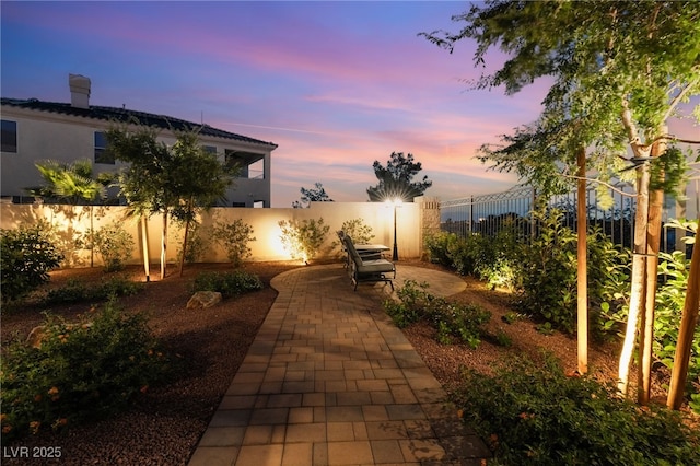 352 Angels Trace Ct, Las Vegas, NV 89148 - patio terrace at dusk with a fenced backyard and a patio
