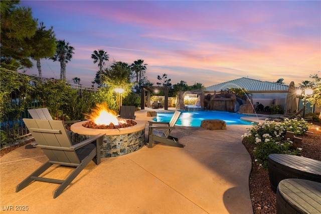 352 Angels Trace Ct, Las Vegas, NV 89148 - pool at dusk with an outdoor fire pit, a patio area, an outdoor pool, and a gazebo