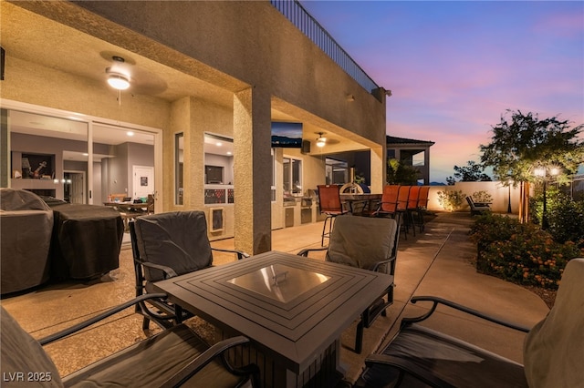 352 Angels Trace Ct, Las Vegas, NV 89148 - patio terrace at dusk featuring outdoor dining space and a patio area