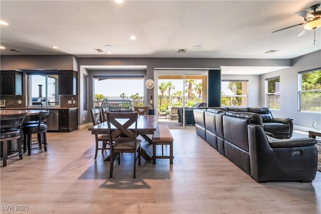 352 Angels Trace Ct, Las Vegas, NV 89148 - dining area featuring a ceiling fan, light wood-style flooring, and recessed lighting