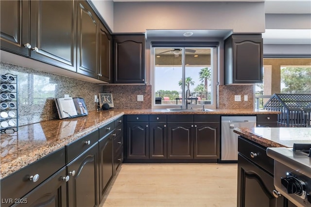 352 Angels Trace Ct, Las Vegas, NV 89148 - kitchen featuring dishwasher, light stone countertops, light wood-style floors, decorative backsplash, and ceiling fan