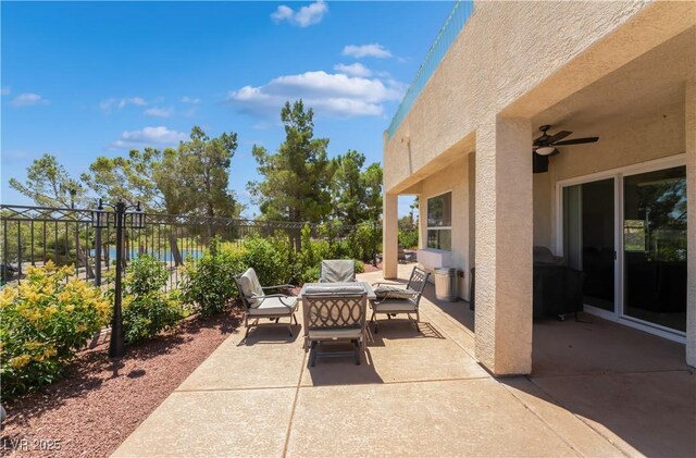 352 Angels Trace Ct, Las Vegas, NV 89148 - view of patio / terrace featuring an outdoor living space, a ceiling fan, and a water view