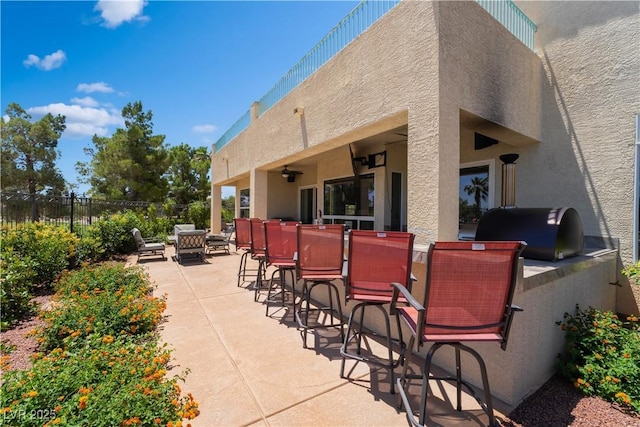 352 Angels Trace Ct, Las Vegas, NV 89148 - view of patio / terrace featuring an outdoor kitchen, ceiling fan, and exterior bar