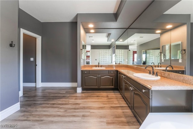 352 Angels Trace Ct, Las Vegas, NV 89148 - full bath featuring double vanity, wood finished floors, and recessed lighting