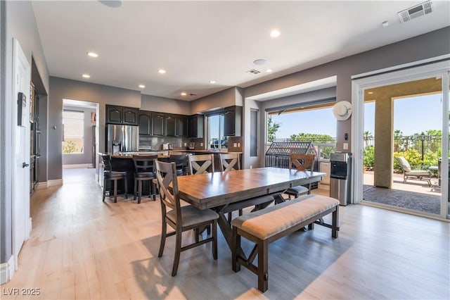 352 Angels Trace Ct, Las Vegas, NV 89148 - dining area with light wood-style floors and recessed lighting