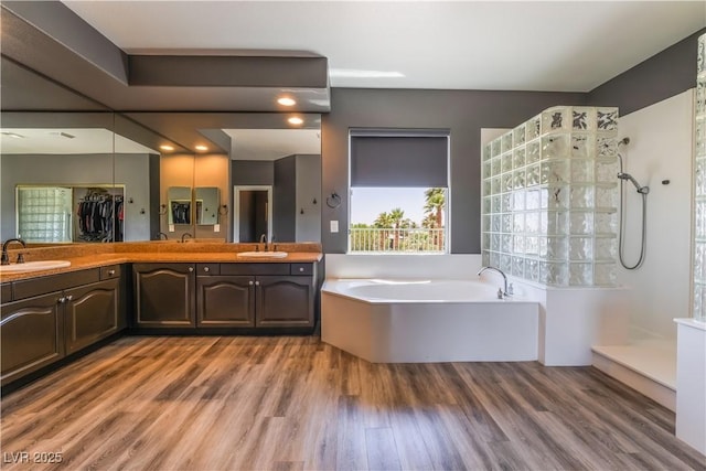 352 Angels Trace Ct, Las Vegas, NV 89148 - full bath with a bath, wood finished floors, double vanity, and walk in shower