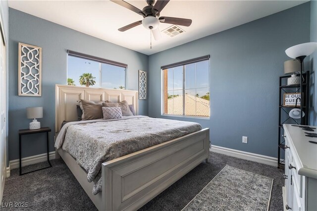 352 Angels Trace Ct, Las Vegas, NV 89148 - bedroom with dark colored carpet and a ceiling fan