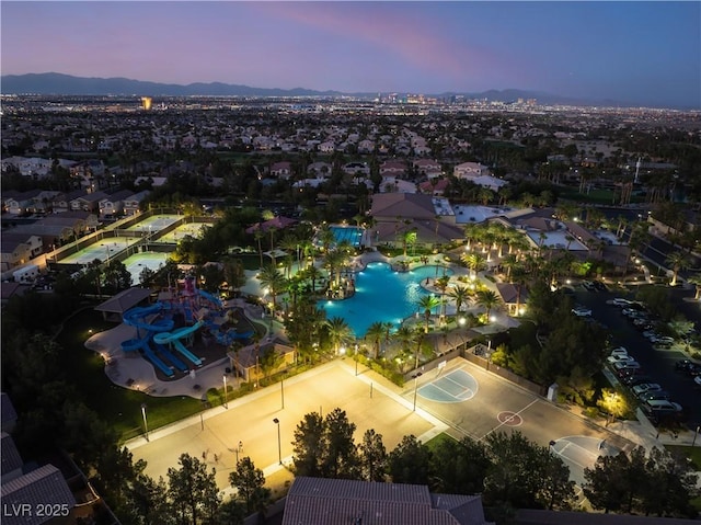 352 Angels Trace Ct, Las Vegas, NV 89148 - aerial view at dusk of view of pool area and a mountain view