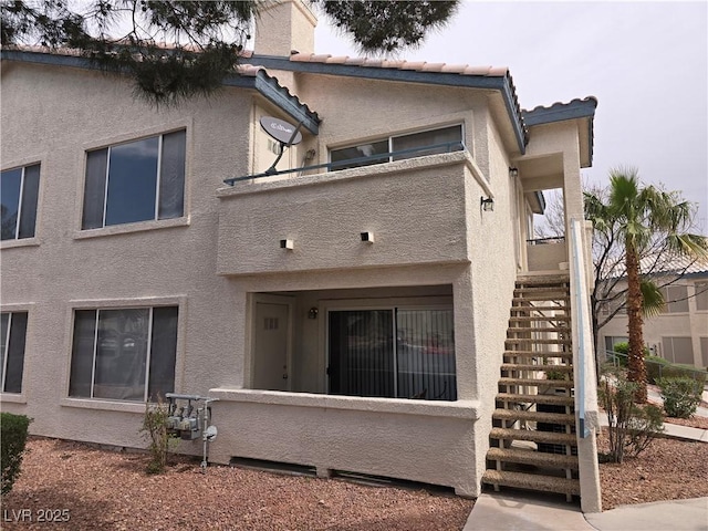 3425 E Russell Rd Unit 265, Las Vegas, NV 89120 - back of property with stairway and stucco siding