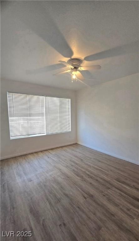 3425 E Russell Rd Unit 265, Las Vegas, NV 89120 - unfurnished room with ceiling fan and wood finished floors