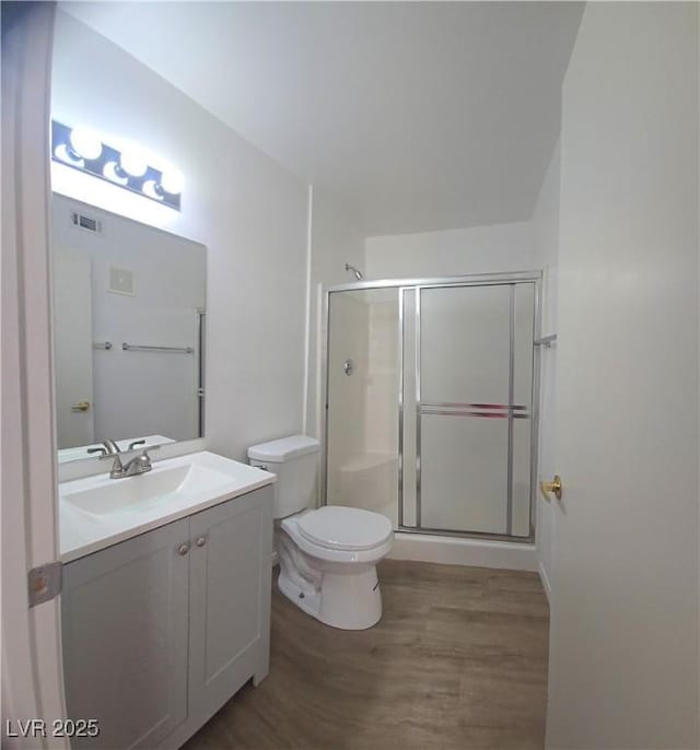3425 E Russell Rd Unit 265, Las Vegas, NV 89120 - bathroom featuring wood finished floors, vanity, and a stall shower