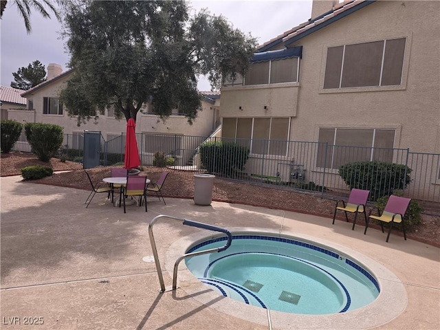 3425 E Russell Rd Unit 265, Las Vegas, NV 89120 - view of swimming pool with a hot tub, a patio, and outdoor dining area