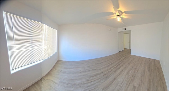 3425 E Russell Rd Unit 265, Las Vegas, NV 89120 - unfurnished room featuring a ceiling fan, light wood-style flooring, and lofted ceiling