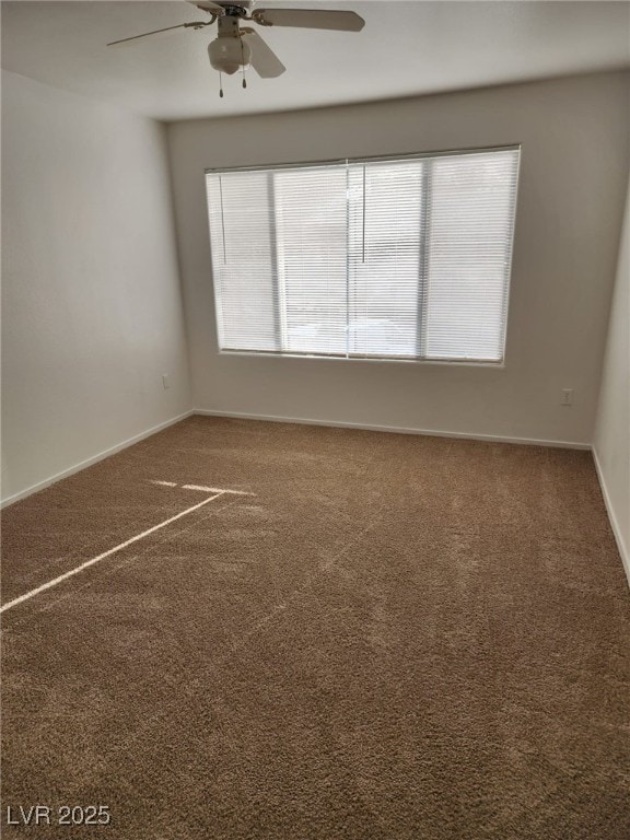 3425 E Russell Rd Unit 265, Las Vegas, NV 89120 - carpeted spare room with ceiling fan and baseboards