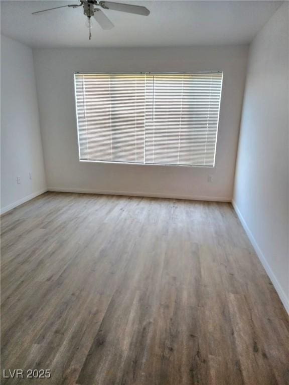 3425 E Russell Rd Unit 265, Las Vegas, NV 89120 - spare room featuring wood finished floors and a ceiling fan