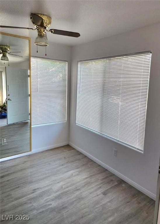 3425 E Russell Rd Unit 265, Las Vegas, NV 89120 - unfurnished room with ceiling fan and wood finished floors