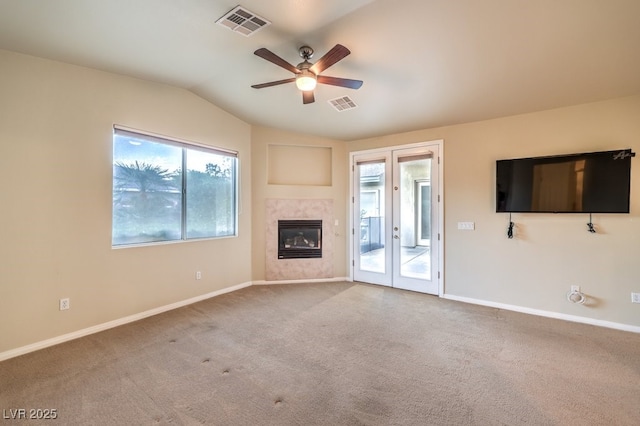 10300 Wellside Hill Ave, Las Vegas, NV 89145 - unfurnished living room with ceiling fan, vaulted ceiling, carpet, a fireplace, and french doors