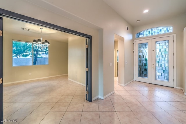 10300 Wellside Hill Ave, Las Vegas, NV 89145 - foyer featuring light tile patterned floors, a chandelier, recessed lighting, and french doors