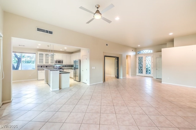 10300 Wellside Hill Ave, Las Vegas, NV 89145 - unfurnished living room with recessed lighting, light tile patterned floors, and a ceiling fan
