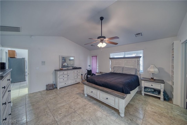 3251 S Parkridge Ave, Pahrump, NV 89048 - bedroom featuring freestanding refrigerator, vaulted ceiling, and ceiling fan