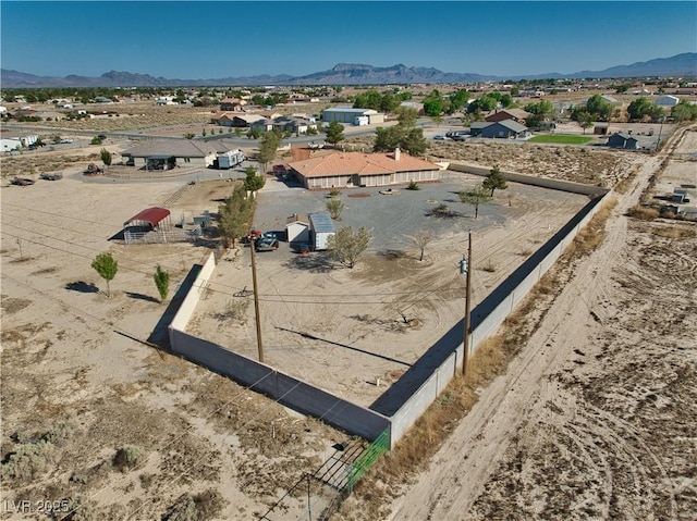 3251 S Parkridge Ave, Pahrump, NV 89048 - aerial perspective of suburban area featuring a mountainous background