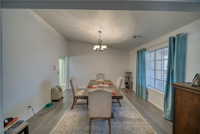 3251 S Parkridge Ave, Pahrump, NV 89048 - dining area featuring a chandelier and wood finished floors