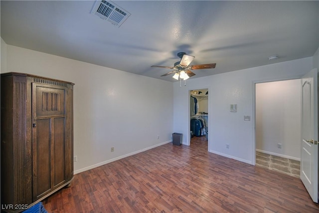 3251 S Parkridge Ave, Pahrump, NV 89048 - unfurnished living room featuring a ceiling fan and wood finished floors