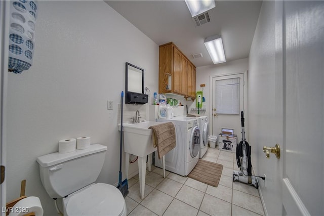 3251 S Parkridge Ave, Pahrump, NV 89048 - washroom with washing machine and clothes dryer and light tile patterned floors