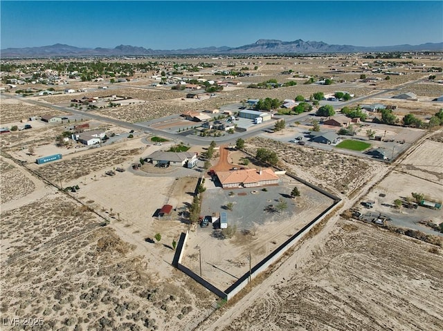 3251 S Parkridge Ave, Pahrump, NV 89048 - aerial view of sparsely populated area featuring a mountainous background and a desert landscape