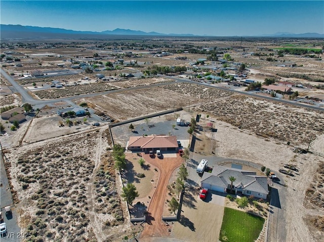 3251 S Parkridge Ave, Pahrump, NV 89048 - aerial view of sparsely populated area featuring a mountain backdrop