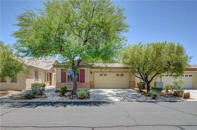 5916 Sorto Lago St, North Las Vegas, NV 89081 - view of front of house featuring a garage, driveway, and stucco siding
