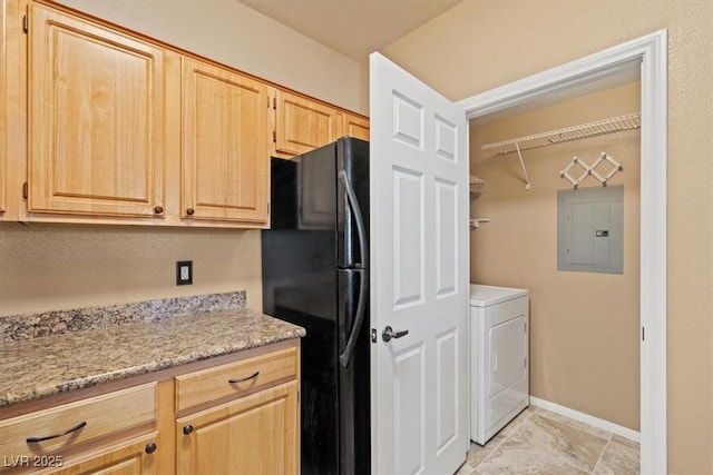 5855 Valley Dr Unit 2130, North Las Vegas, NV 89031 - kitchen featuring electric panel, washer / clothes dryer, freestanding refrigerator, light brown cabinets, and light stone counters