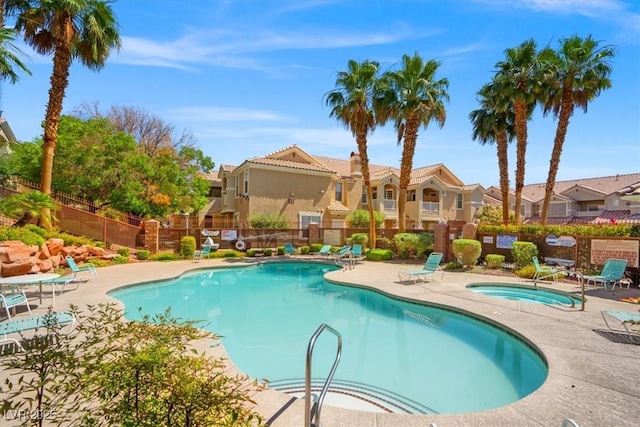 5855 Valley Dr Unit 2130, North Las Vegas, NV 89031 - community pool with a patio area, a hot tub, and a residential view
