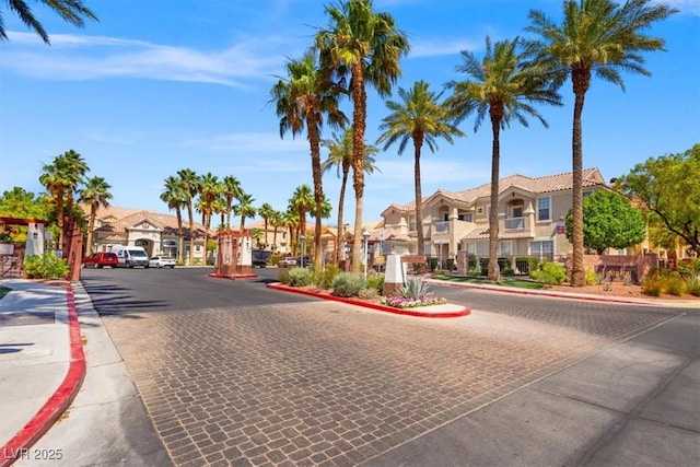 5855 Valley Dr Unit 2130, North Las Vegas, NV 89031 - view of road featuring a residential view, curbs, sidewalks, and a gated entry