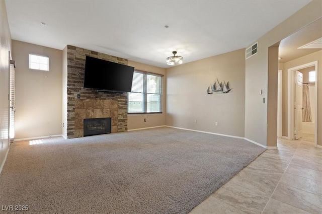 5855 Valley Dr Unit 2130, North Las Vegas, NV 89031 - unfurnished living room featuring a fireplace and a chandelier
