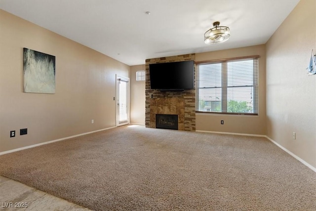 5855 Valley Dr Unit 2130, North Las Vegas, NV 89031 - unfurnished living room featuring carpet flooring and a fireplace