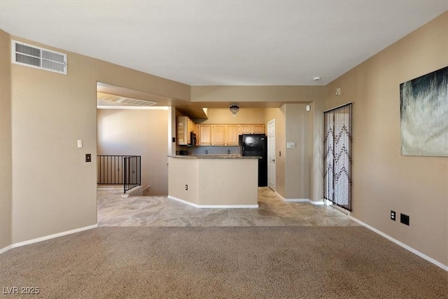 5855 Valley Dr Unit 2130, North Las Vegas, NV 89031 - kitchen featuring light colored carpet, freestanding refrigerator, light brown cabinets, a peninsula, and open floor plan