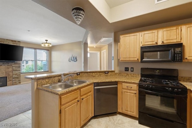 5855 Valley Dr Unit 2130, North Las Vegas, NV 89031 - kitchen with black appliances, light brown cabinetry, a peninsula, and open floor plan