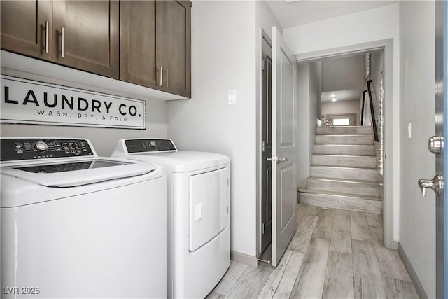 8175 Caldera Creek St, Las Vegas, NV 89113 - laundry room featuring separate washer and dryer, light wood-style flooring, and cabinet space