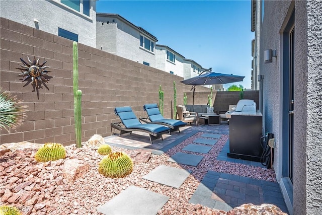 8175 Caldera Creek St, Las Vegas, NV 89113 - fenced backyard featuring outdoor lounge area and a patio area