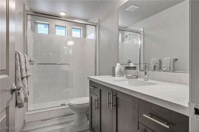 8175 Caldera Creek St, Las Vegas, NV 89113 - full bathroom featuring vanity, wood finished floors, and a shower stall