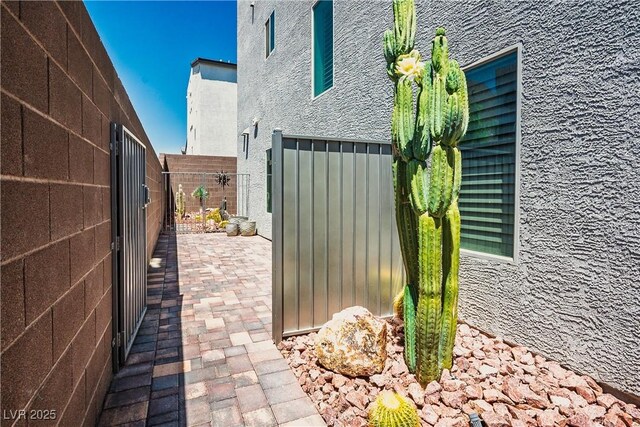 8175 Caldera Creek St, Las Vegas, NV 89113 - fenced backyard with a patio