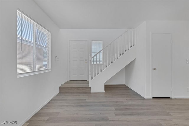 3741 Cactus Wheel Ct, Las Vegas, NV 89129 - staircase with healthy amount of natural light and wood finished floors