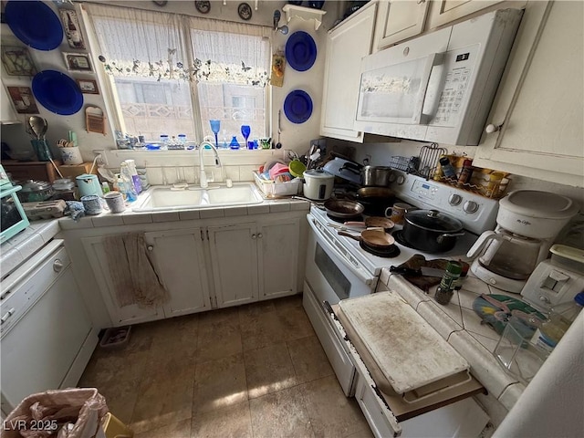 6271 Explorer Dr, Las Vegas, NV 89103 - kitchen featuring tile countertops and white appliances