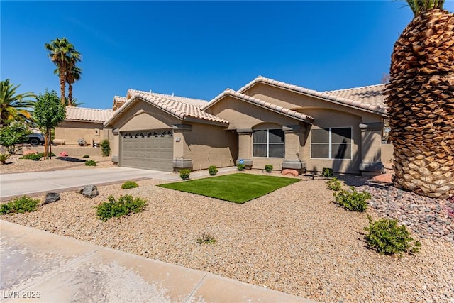 1761 Summerwood Cir, Henderson, NV 89012 - view of front of property featuring stucco siding, a tile roof, a garage, and concrete driveway