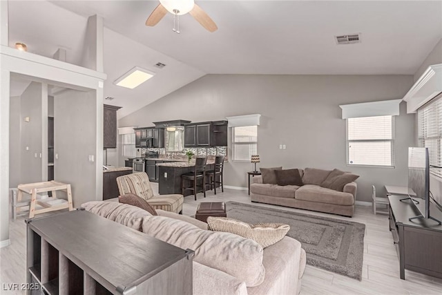 1761 Summerwood Cir, Henderson, NV 89012 - living room featuring lofted ceiling, ceiling fan, and light wood-style floors