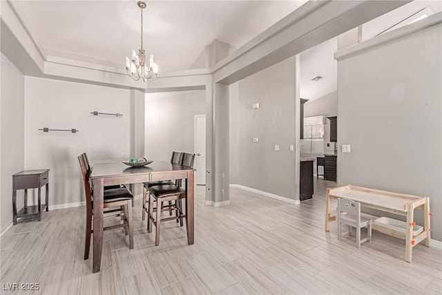 1761 Summerwood Cir, Henderson, NV 89012 - dining space with a chandelier, light wood-type flooring, and vaulted ceiling