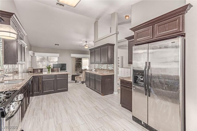 1761 Summerwood Cir, Henderson, NV 89012 - kitchen featuring stainless steel fridge, ceiling fan, gas range, and dark brown cabinetry