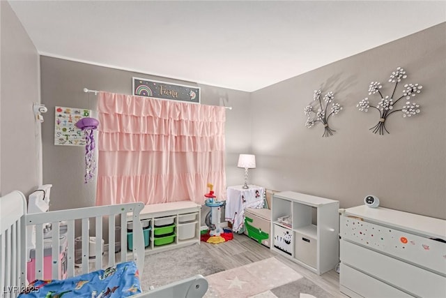 1761 Summerwood Cir, Henderson, NV 89012 - bedroom with wood finished floors and a crib